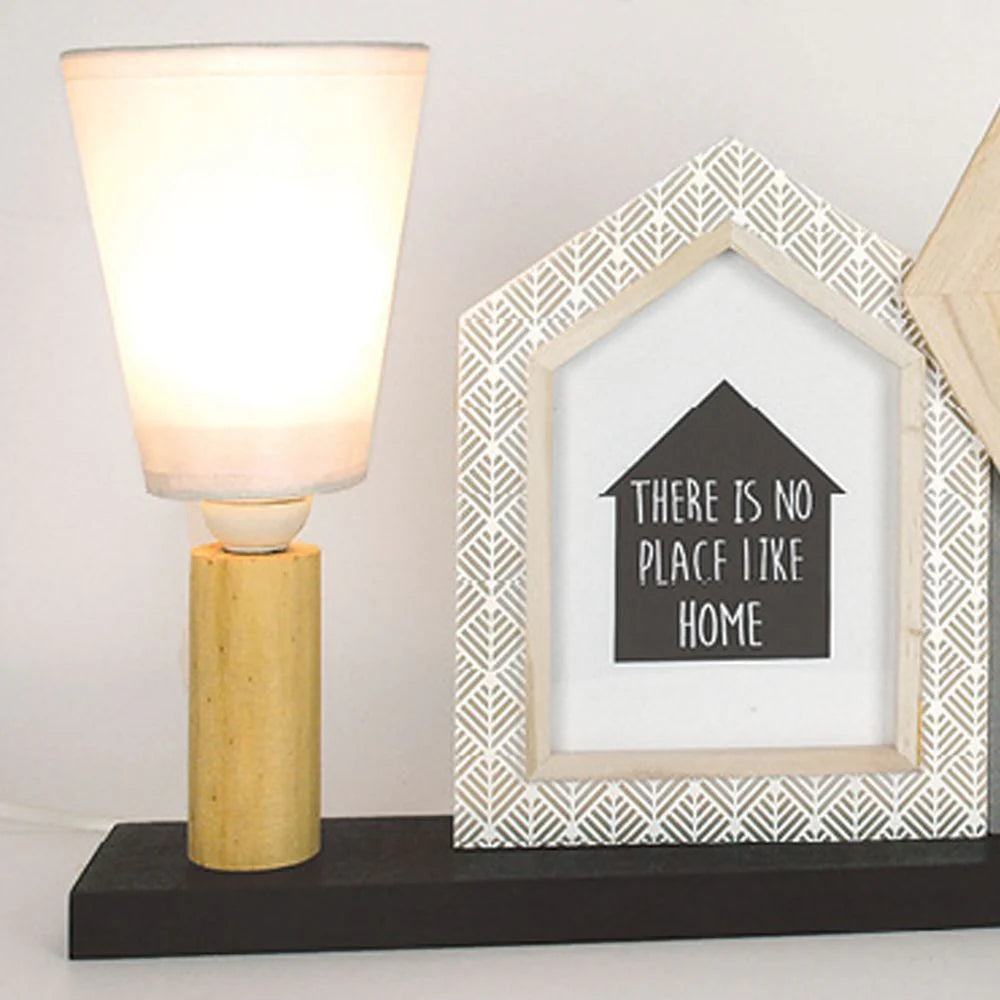 Table lamp with a decorative house-shaped frame displaying 'There is no place like home' text.