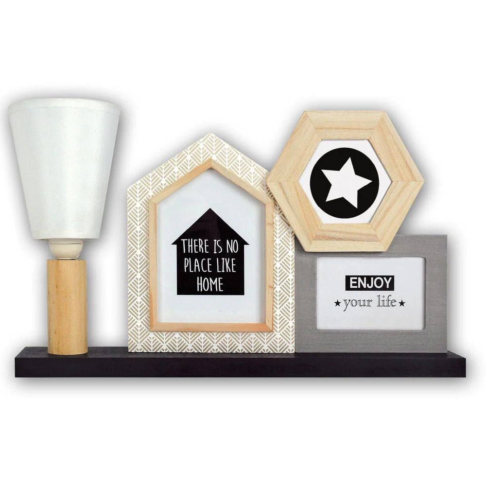 Decorative shelf with framed quotes and a lamp on a white background