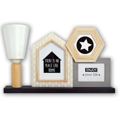 Decorative shelf with framed quotes and a lamp on a white background