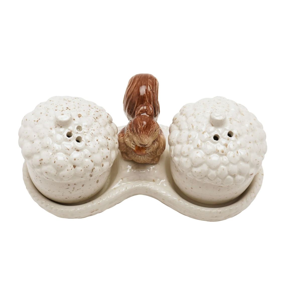 A ceramic salt and pepper shaker set featuring two acorn-shaped containers with textured cream glazes and a small brown squirrel figurine in the center, all on a matching base against a white background.