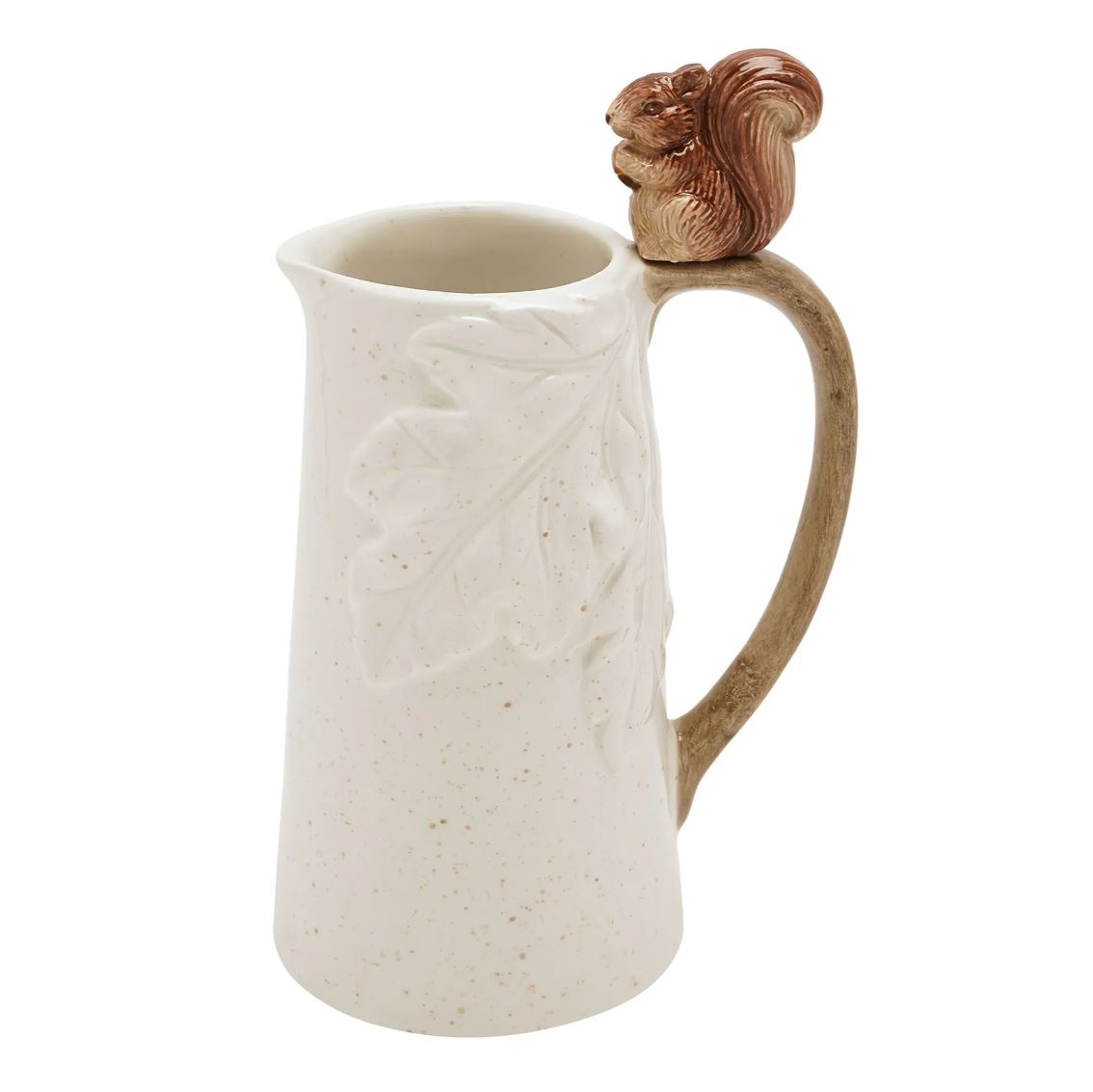 A speckled cream-colored ceramic pitcher with embossed leaf details, a brown handle, and a small brown squirrel figurine on top of the handle, shown against a plain white background.
