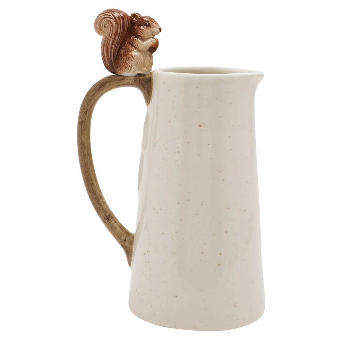A ceramic pitcher with a speckled off-white body, a brown handle shaped like a tree trunk, and a small brown squirrel figurine perched on the rim, shown on a plain white background.