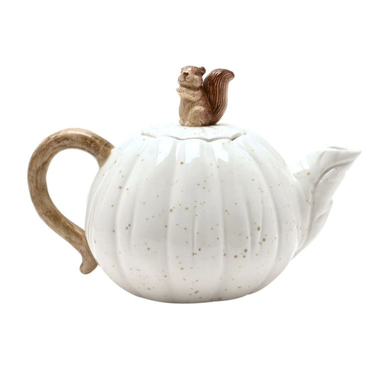A white ceramic pumpkin-shaped teapot with subtle gold speckles, a brown handle, and a small brown squirrel figurine on top, shown against a plain white background.