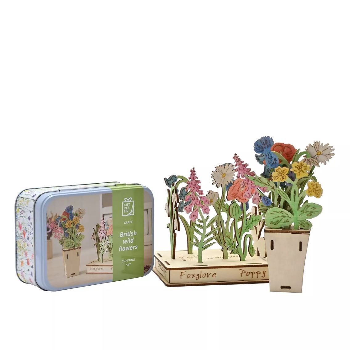 Apples To Pears Gift In A Tin British Wildflowers fully made next to the tin