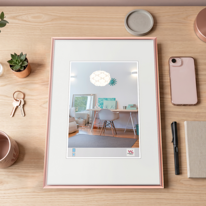 Framed picture on a desk with office items around