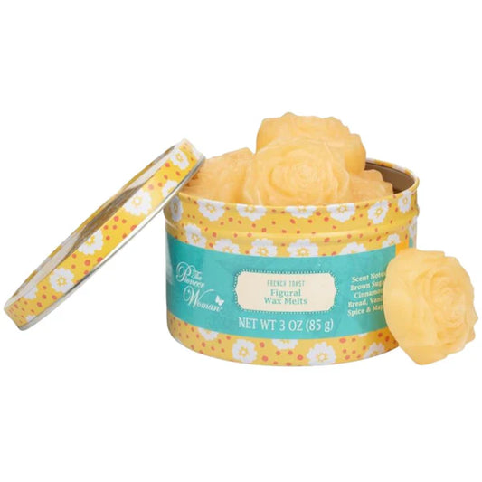 Tin of yellow wax melts with floral design on a white background