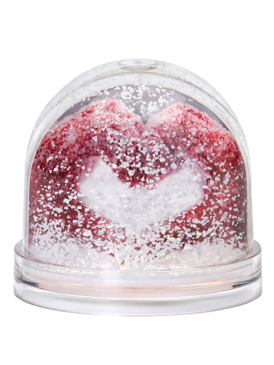 Clear snow globe with red mittens and white snow inside on a white background