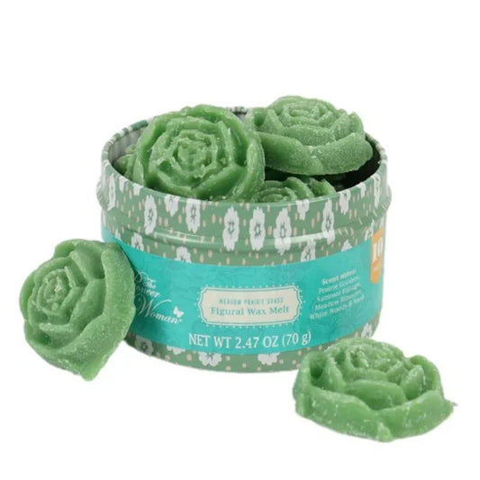 Green rose-shaped wax melts in a decorative tin with a white floral pattern on a white background.