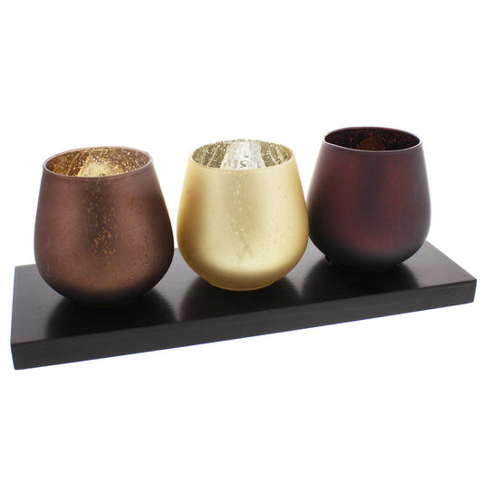 Hestia Set of 3 Warm Browns and Gold Glass Tea Light Holders On Wooden Plinth